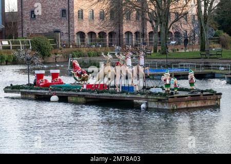 Father Christmas on his sleigh on Chichester Canal West Sussex England Stock Photo