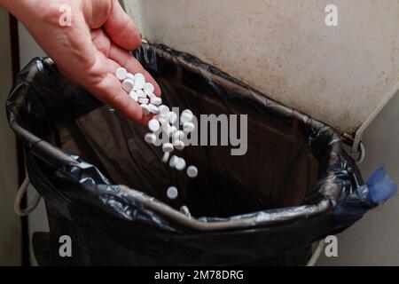 Hand Throwing Pills Away. Health Concept Stock Photo, Picture and Royalty  Free Image. Image 72740848.