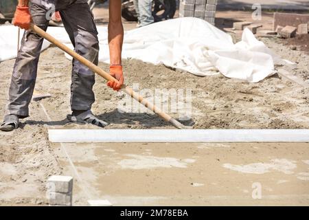 Laying paving slabs sale on sand base