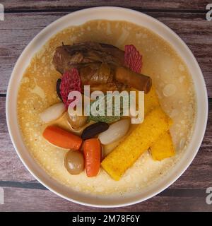 Lamb smil pie served with fried polenta, carrot, turnip, mushroom and sauce Stock Photo
