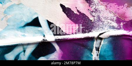Old grunge torn collage posters creased crumpled paper placard texture background. Ripped faded paper backdrop surface placard with graffiti painting Stock Photo
