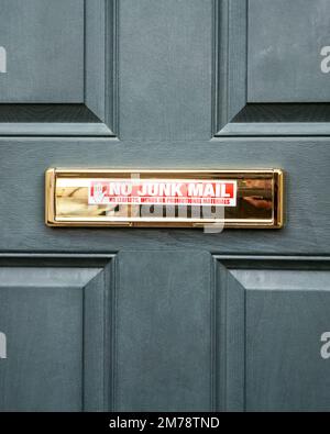No junk mail sticker on polished brass letter box Stock Photo