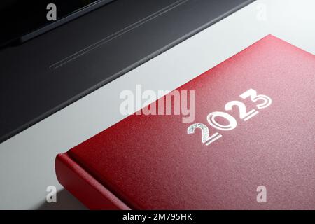 2023 red diary on a desk. Stock Photo
