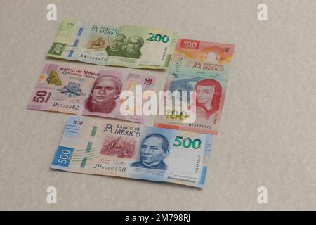 Banknotes of 500,200,100 and 50 Mexican pesos, arranged on a table, with copy space. Stock Photo