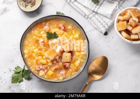 Lentil pea soup garnish with ham Stock Photo