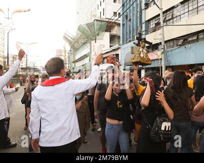 Manila, Philippines. 08th Jan, 2023. Quiapo Church Lay Ministers bless the devotees replicas and handkerchiefs by holy water. Catholic devotees flock to Quiapo Church in Manila to express their devotion to the Black Nazarene, a life-sized image of dark skinned, kneeling Jesus Christ carrying the cross. A day before it's feast on January 9. This festive activity was put on hold for two years because of the COVID-19 pandemic. (Photo by Josefiel Rivera/SOPA Images/Sipa USA) Credit: Sipa USA/Alamy Live News Stock Photo