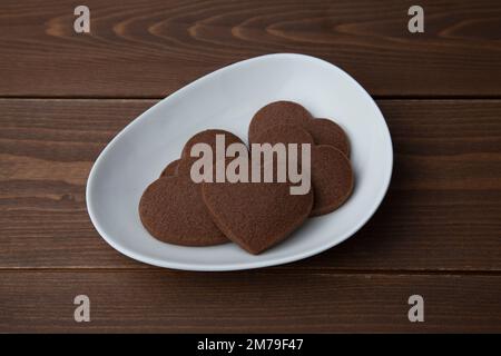 heart shaped chocolate cookies isolated on tablecloth Stock Photo