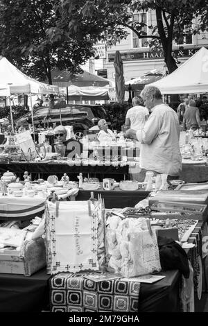 On the streets of Vienna, people shopping at a street market or going about their daily business Stock Photo