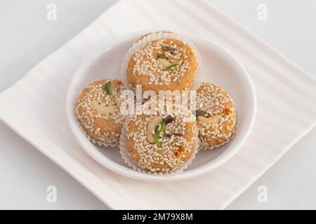 Winter Season Special Traditional Punjabi Mithai Til Tikki Or Tilkut Gud Mawa Bati Is Made Of Dry Roasted Sesame Seeds With Mava, Khoya, Jaggery, Gur, Stock Photo