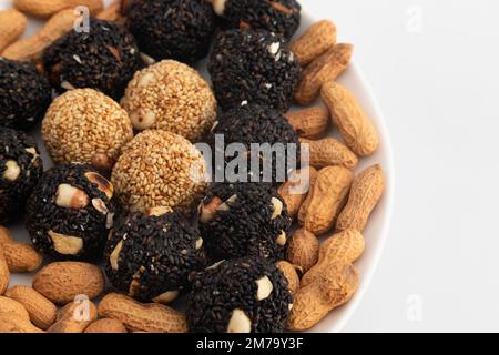 Indian Winter Delicacy Black Ball Shaped Kaala Tilgul Laddu Or Kale Til Ki Laddo Is Made Of Roasted Sesame Seed, Jaggery, Gur, Peanut, Gud, Mungfali I Stock Photo