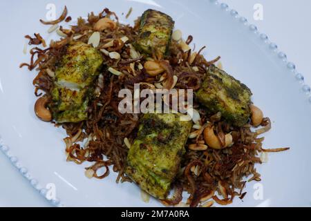 chermoula samak, traditional arabic middle eastern flavored rice with spice marinated grilled fish Stock Photo