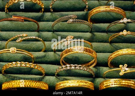 selective focus to gold and bracelet are gold jewelry in the showcase, the gold shop Stock Photo