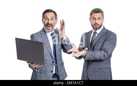 photo of amazed businessmen freelancer with laptop. two businessmen freelancer using laptop. Stock Photo