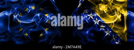 Flags of EU, European Union vs Bosnia and Herzegovina, Bosnian. Smoke flag placed side by side on black background. Stock Photo