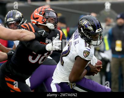 Baltimore Ravens quarterback Anthony Brown (12) runs with the ball as  Tennessee Titans linebacker Jack Gibbens (50) tries to stop him during the  second half of a preseason NFL football game, Thursday