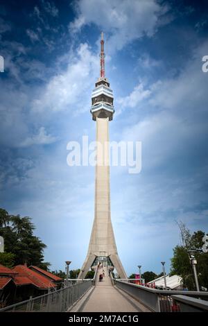 Picture of the Avala tower seen from the nearby forest. The Avala Tower is a 204.68 m tall telecommunications tower located on Mount Avala, in Belgrad Stock Photo