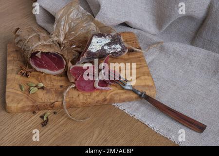 Close-up homemade duck jamon, homemade snack, jerky on board, selective focus Stock Photo