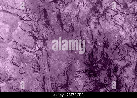 Aquatic ripple wavy lilac water surface, water texture background, top view Stock Photo