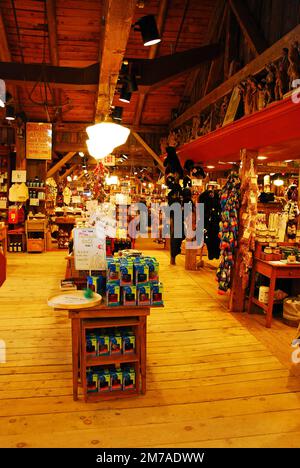 The interior of a large country store in Vermont show handcrafted clothes, souvenirs and toys Stock Photo