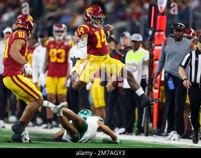 Arlington, TX, USA. 2nd Jan, 2023. USC Trojans running back Raleek Brown (14) hurdles a defender during the Goodyear Cotton Bowl game between the Tulane Green Wave and the University of Southern California Trojans on January 2, 2023 at AT&T Stadium in Arlington, Texas. (Mandatory Credit: Freddie Beckwith/MarinMedia.org/Cal Sport Media) (Absolute Complete photographer, and credits required).Television, or For-Profit magazines Contact MarinMedia directly. Credit: csm/Alamy Live News Stock Photo