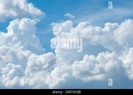 White fluffy clouds on blue sky. Soft touch feeling like cotton. White puffy cloudscape. Beauty in nature. Close-up white cumulus clouds texture Stock Photo