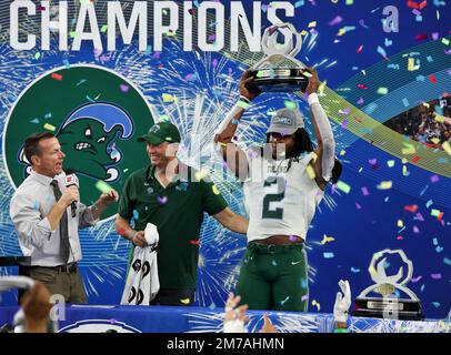 Arlington, TX, USA. 2nd Jan, 2023. Tulane Green Wave linebacker Dorian Williams (2) accepts the MVP trophy during the Goodyear Cotton Bowl game between the Tulane Green Wave and the University of Southern California Trojans on January 2, 2023 at AT&T Stadium in Arlington, Texas. (Mandatory Credit: Freddie Beckwith/MarinMedia.org/Cal Sport Media) (Absolute Complete photographer, and credits required).Television, or For-Profit magazines Contact MarinMedia directly. Credit: csm/Alamy Live News Stock Photo