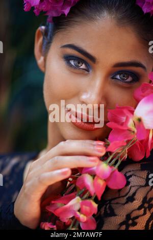 Eyes that hypnotize. A portrait of a beautiful woman wearing colorful. Stock Photo