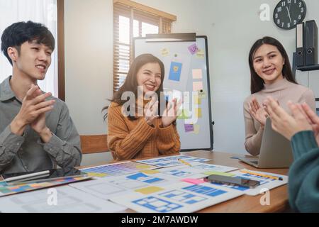 Young Asian Start up new business working at creative office. Modern start-up business team. Co-workers ui, ux startup small business Stock Photo