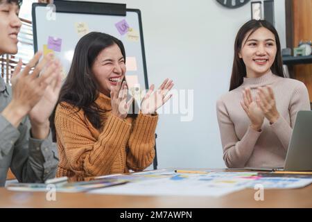 Young Asian Start up new business working at creative office. Modern start-up business team. Co-workers ui, ux startup small business Stock Photo