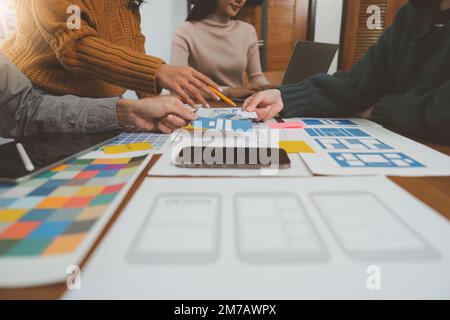 Young Asian Start up new business working at creative office. Modern start-up business team. Co-workers ui, ux startup small business Stock Photo