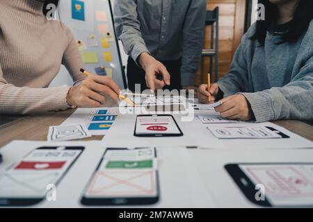 Young Asian Start up new business working at creative office. Modern start-up business team. Co-workers ui, ux startup small business Stock Photo
