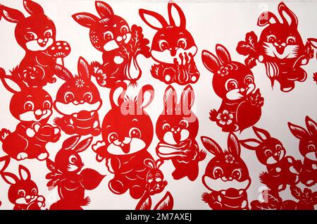 HANDAN, CHINA - JANUARY 9, 2023 - Folk paper-cutting artist Feng Shiping creates paper-cuts for the Year of Rabbit in Handan city, North China's Hebei Stock Photo