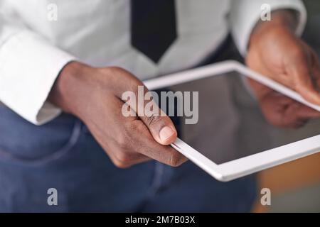 Technology takes you to the top. a man holding his digital tablet. Stock Photo