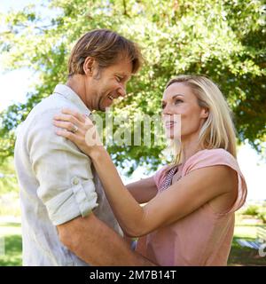 You make me proud to be your wife. an affectionate mature couple enjoying a day in the park. Stock Photo