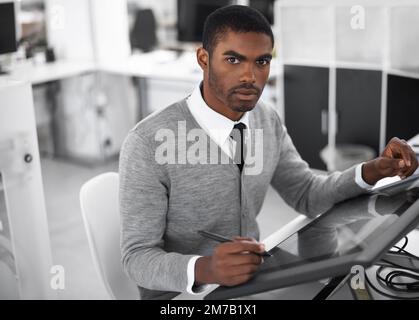 Smart technology makes everything easier. A young man working on a large touchscreen. Stock Photo