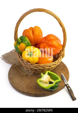 colored peppers over white background Stock Photo