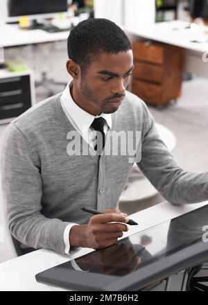 Smart technology makes everything easier. A young man working on a large touchscreen. Stock Photo