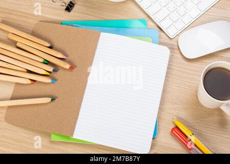Back to school concept. Top view photo of notepads, pens, sharpeners, ruler, staplers, clips, markers and erasers on wooden table Stock Photo