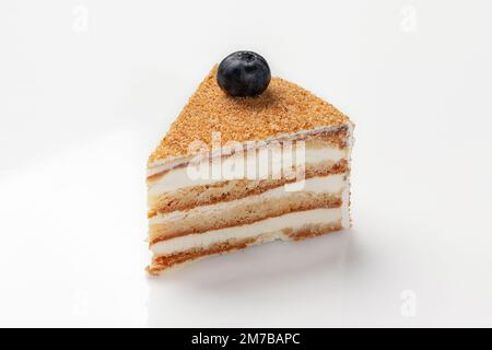 Slice of jaconde sponge cake with mascarpone whipped cream Stock Photo