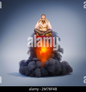 pensive man sitting in a chair taking flight with flames and smoke. Stock Photo
