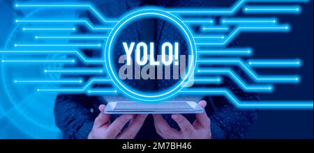 Sign displaying Yolo. Word Written on stand for You only live once popular phase among students and teens Stock Photo