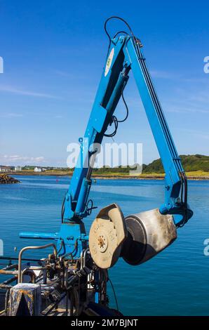 8 August 2019 A hydraulic flexible net boom arm on a small trawler berthed at Ardglass Harbour in County Down Northern Ireland Stock Photo