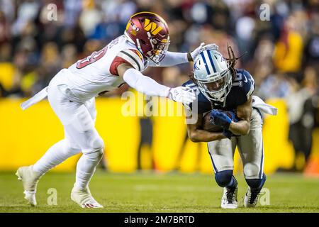 Landover, MD, USA. 8th Jan, 2023. Dallas Cowboys wide receiver KaVontae  Turpin (9) is tackled by Washington Commanders wide receiver Dyami Brown  (2) on the punt return during the game between the