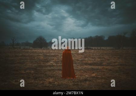 Dark red riding hood. Dramatic cloudscape Stock Photo