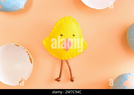 Diy easter chicken in eggshell. concept. beige background. layout. Stock Photo