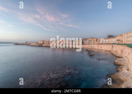 The breathtaking scenery of the Ortigia seafront in Syracuse Sicily in  the sunrise of a new day Stock Photo