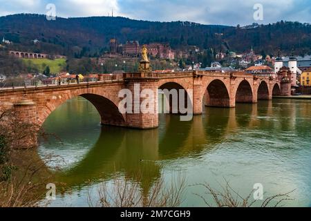 Nice view of Heidelberg's arch bridge Karl-Theodor-Brücke or Alte Brücke (Old Bridge) with its gate and two towers over the Neckar river. In the... Stock Photo