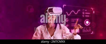 Woman, employee wearing VR glasses and working on virtual holographic computer screen. Analytics, infographic Stock Photo