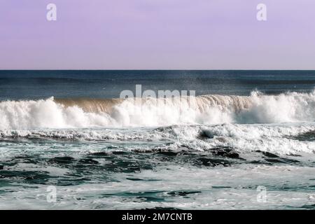 big waves splashing and hitting the shore Stock Photo - Alamy