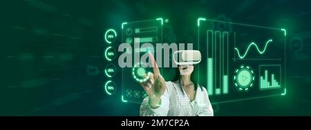 Woman, employee wearing VR glasses and working on virtual holographic device screen. Hi-tech user interface. Stock Photo
